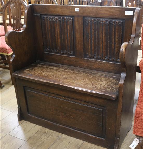 An oak monks bench W.90cm